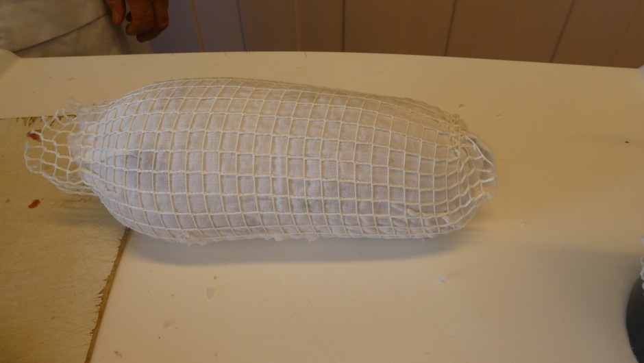 Et klede rundt rullen, ny stømpe, klar for å trekkes i vann.